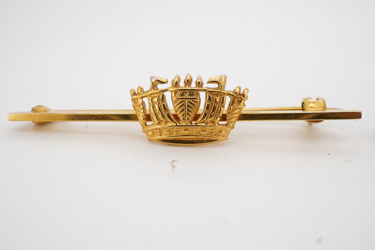 An Edwardian 15ct and seed pearl cluster set coronet bar brooch, 36mm, gross 2.4 grams and 9ct gold coronet bar brooch, 3.5 grams.